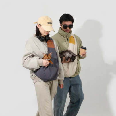 Two people walking with pets in a casual setting